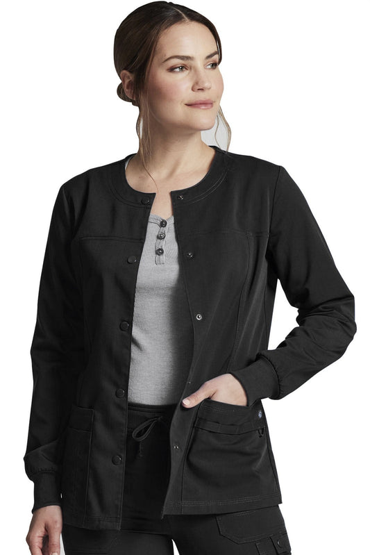 Medical staff wearing a Dickies Balance black jacket (DK380) over a gray under scrub on a white background